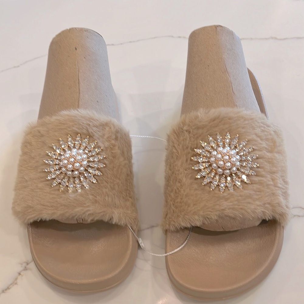 Ladies Beige Slip on Slipper with a Pearl & Rhinestones Medallion on fur. 9